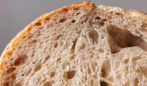 A close-up of a sliced loaf of bread