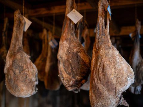 Cured meats hanging in display