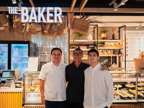 Joel's Place CEO, COO, and CEO's son in front of a display case full of various breads and pastries at The Baker section in Joel's Place Glorietta 4