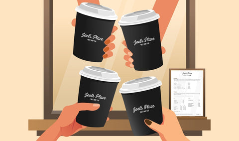 Angled shot of friends holding different cups of espresso-based coffee drinks at Joel’s Place