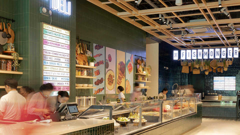 A wide shot of The Deli and The Fishmonger section with various fresh food displayed at Joel’s Place Rockwell