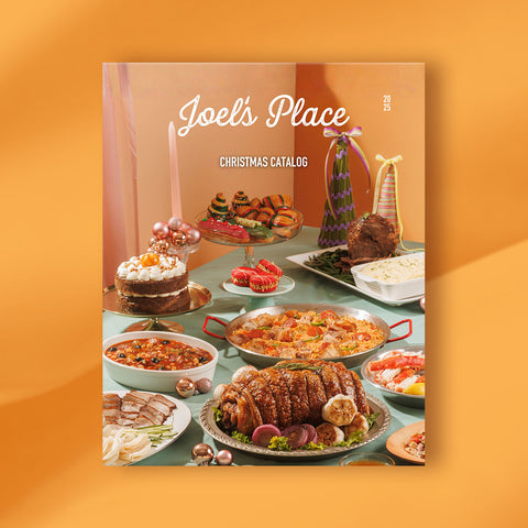 The cover of the Joel's Place Christmas 2025 catalog is against an orange background.