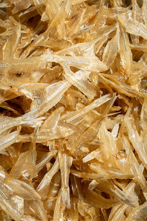 A close up of a pile of dried boneless dilis