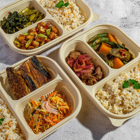 An image of Joel's Place meal et including Bistel meal set, Daing na bangus meal set, and Green goddess tofu meal set packaged in beige compartmented containers
