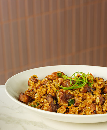 This image features an angled shot of a steak rice, available at Joel's Place.